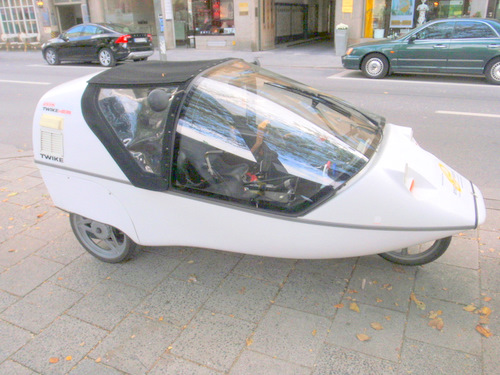 Homemade enclosed side by side tandem riding bicycle.